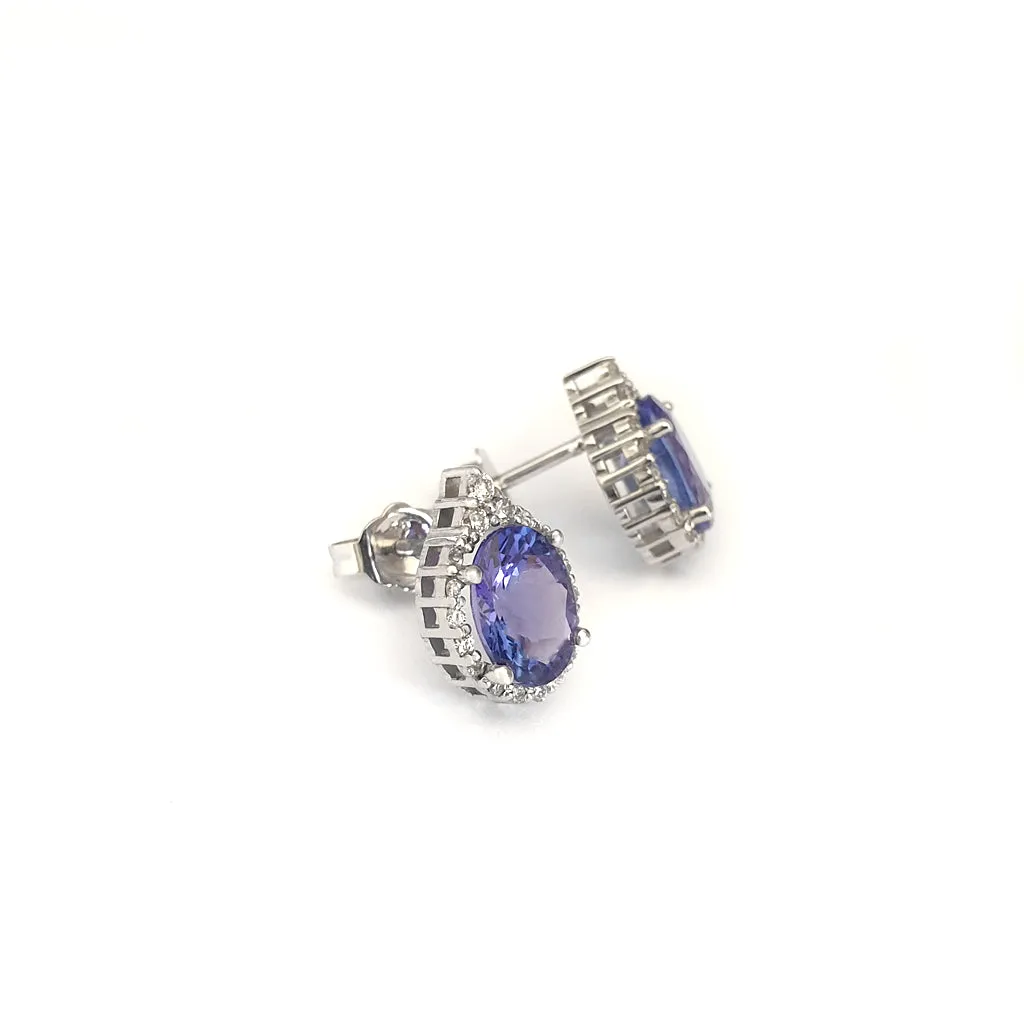 Enchanting Oval Tanzanite Trilogy Detail Diamond Halo Earrings