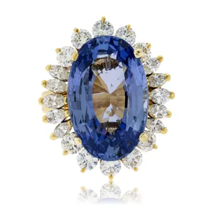 Large Oval Blue Sapphire with Round and Marquise Diamond Halo Style Ring